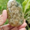 a hand holding a stone