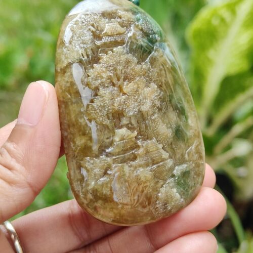 a hand holding a stone