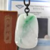 a jade pendant on a string