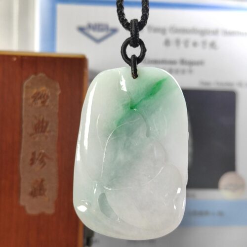 a jade pendant on a string