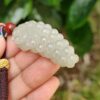 a hand holding a white object