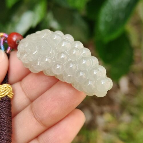 a hand holding a white object