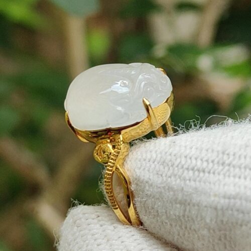 a ring with a white stone on it