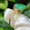 a ring with a jade stone on it