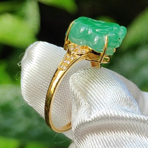 a ring with a jade stone on it