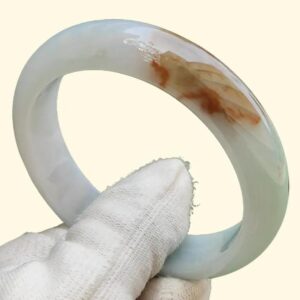 a hand holding a white gloved hand