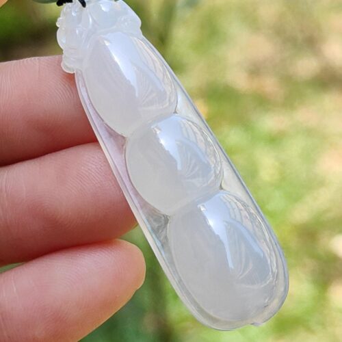 a hand holding a clear object