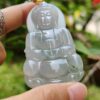 a person holding a jade pendant