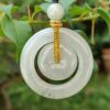 a jade pendant from a branch