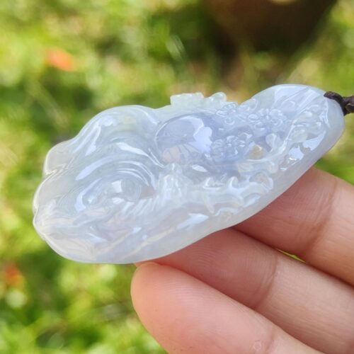 a hand holding a white object