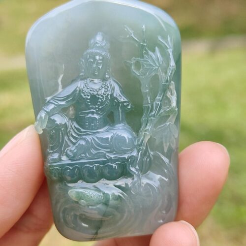 a person holding a jade object
