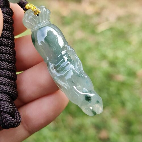 a hand holding a necklace