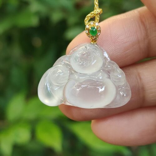 a hand holding a necklace