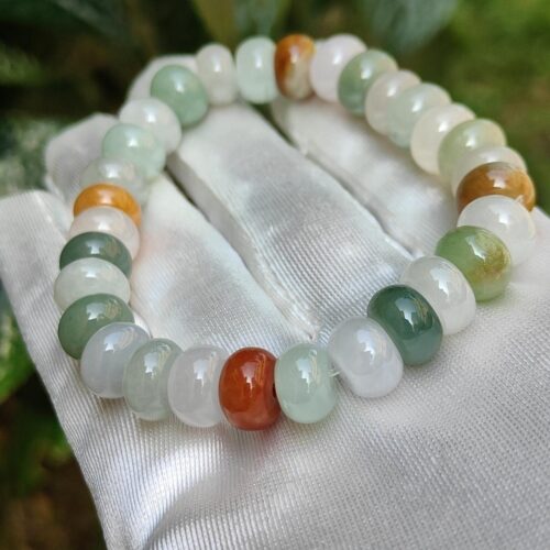 a bracelet on a white cloth