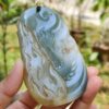 a hand holding a stone