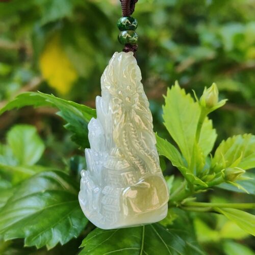 a jade pendant from a branch