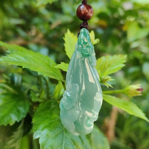 a green jade pendant from a string