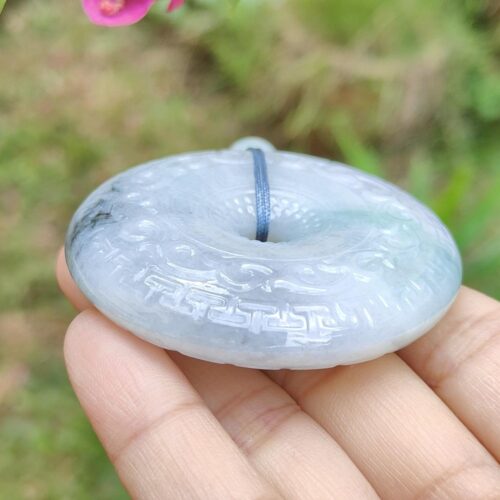 a hand holding a round object