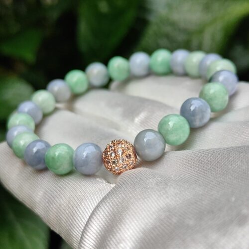 a bracelet on a pillow