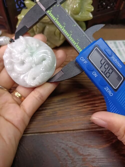 a person measuring a piece of jewelry