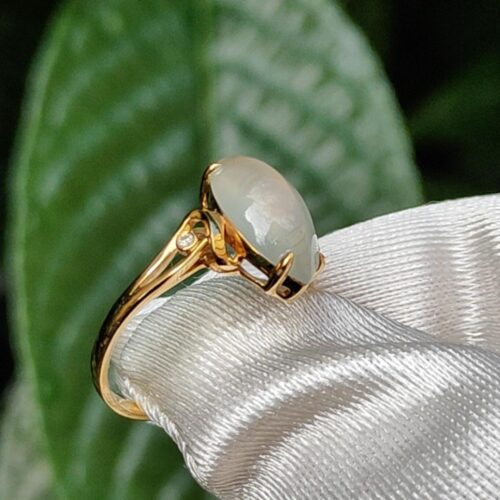 a gold ring with a stone on it