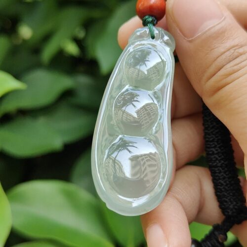 a hand holding a necklace