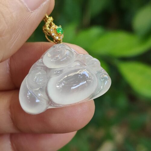 a hand holding a necklace