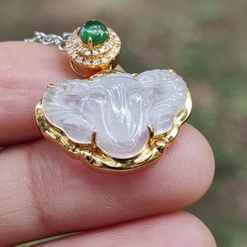 a hand holding a necklace