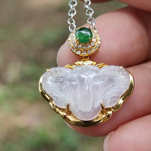 a hand holding a necklace