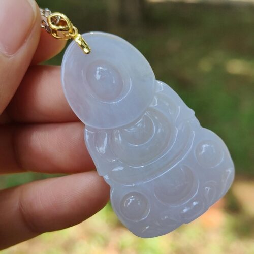 a hand holding a necklace