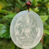 a round pendant with a picture of a person on it