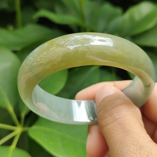 a hand holding a bracelet