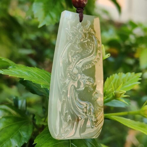 a jade pendant from a tree