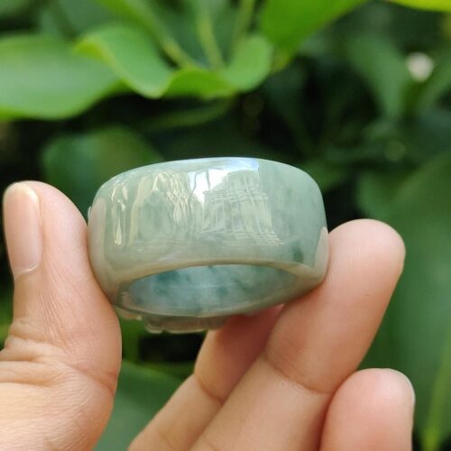 a hand holding a ring