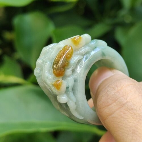 a hand holding a ring