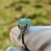 a ring with a jade stone on it