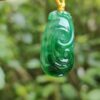 5c6d43920b68b25802e1c36422e78f76-1 a green jade pendant from a string