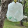 a jade pendant from a tree