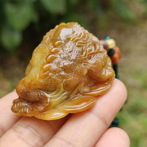 a hand holding a small object