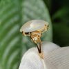 a gold ring with a stone in it