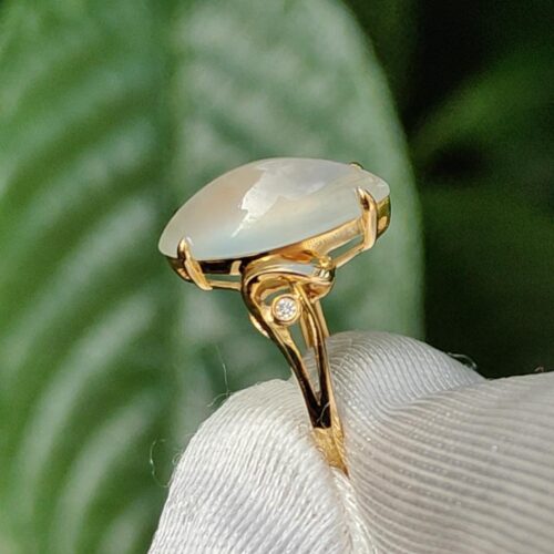 a gold ring with a stone in it