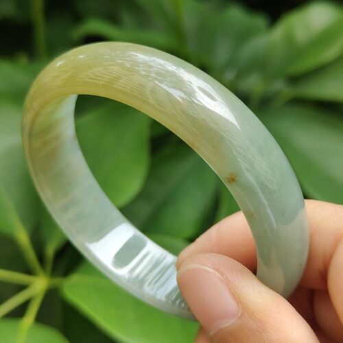 a hand holding a bracelet