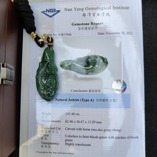 a jade pendant on a paper