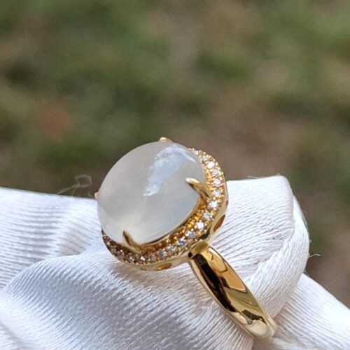 a gold ring with a stone in it