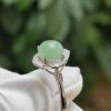a ring with a green stone