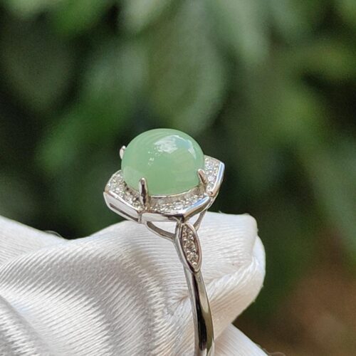 a ring with a green stone