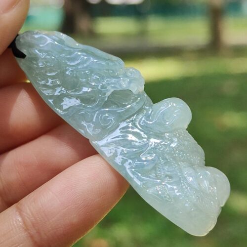 a hand holding a blue stone