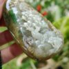 a hand holding a stone