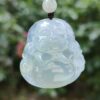 a close up of a jade pendant