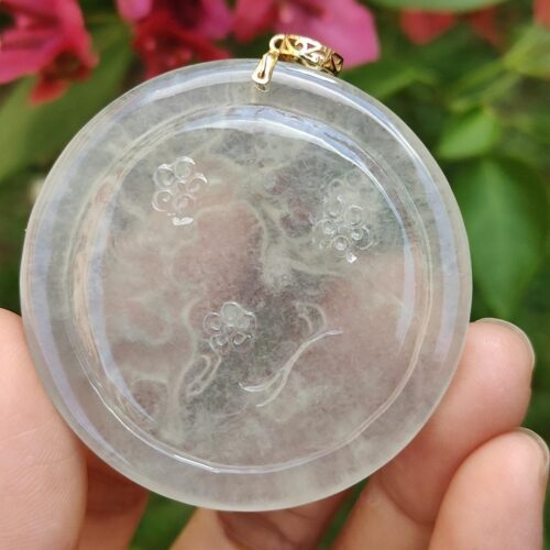 a hand holding a round object